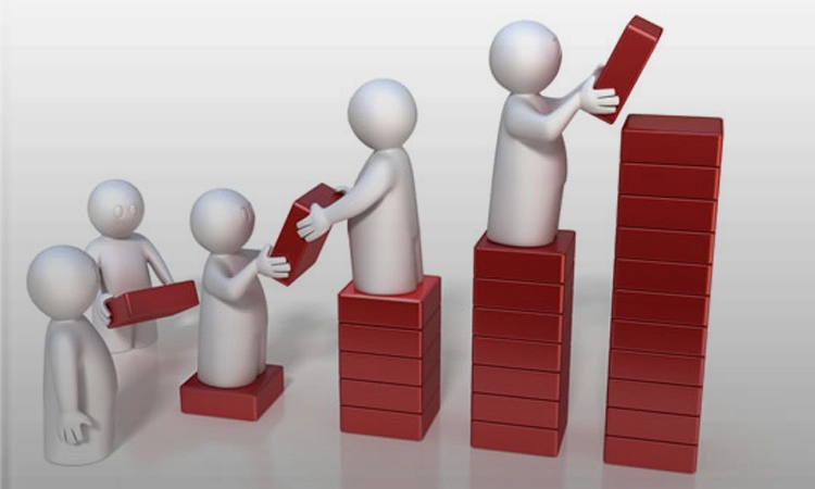 People building progress blocks representing consistent social media management and brand growth.